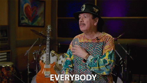 Man In Hat Standing In Front Of Drum Set GIF