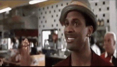 Man In Hat Standing In Restaurant GIF