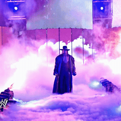 Man In Hat Standing In Smoke GIF