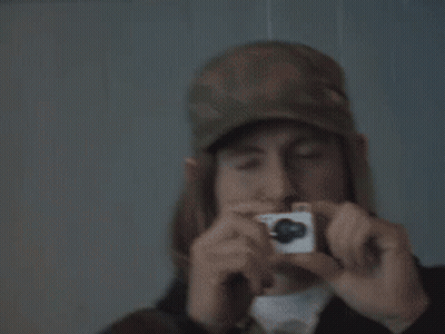 Man In Hat Taking Picture With Camera GIF