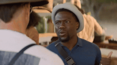Man In Hat Talking To Another Man In Restaurant GIF