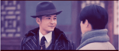 Man In Hat Talks To Man In Suit GIF