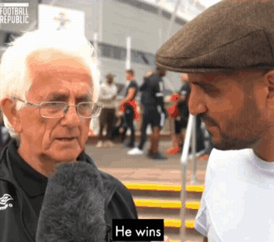 Man In Hat Talks To Older Man Saying He Wins GIF