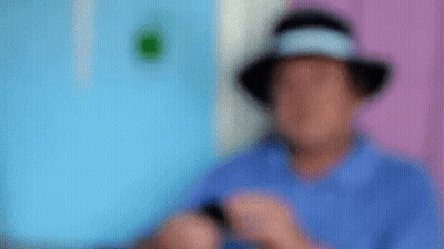 Man In Hat Using Cell Phone GIF