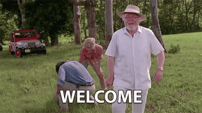 Man In Hat Walking Through Grassy Field Welcome GIF