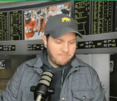 Man In Hat With Bear Talking Into Microphone GIF