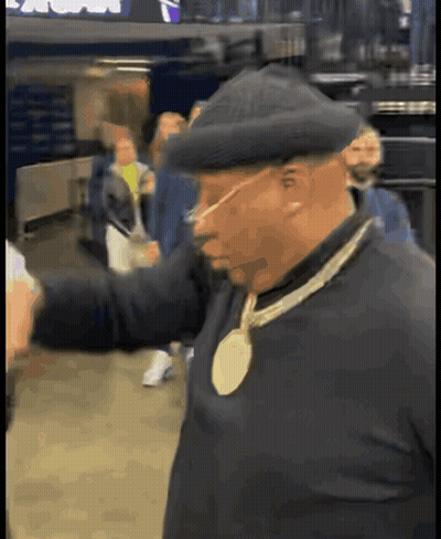 Man In Hat With Gold Medal Necklace GIF