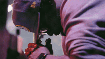 Man In Hat With Letter A Holding Cell Phone GIF