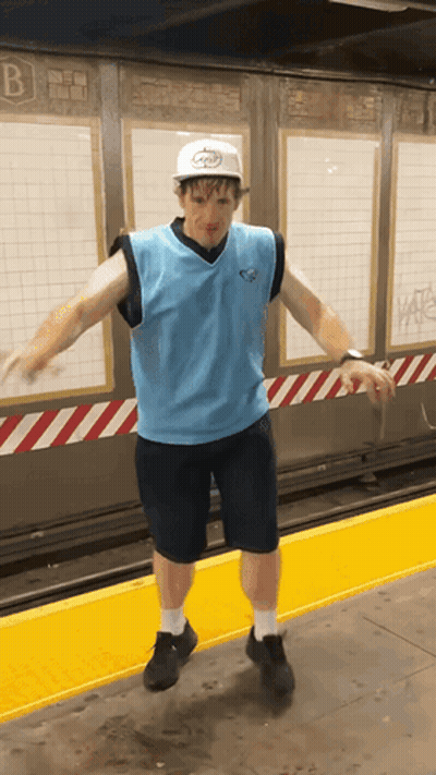 Man In Hat With Letter B On Yellow Platform GIF