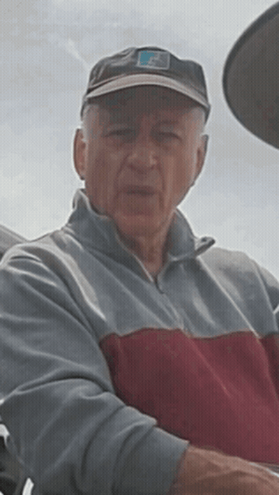 Man In Hat With Letter F Looking At Camera GIF