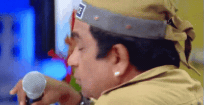 Man In Hat With Letter G Holding Microphone GIF