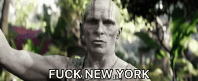 Man In Hat With Letter M Next To Another Man GIF