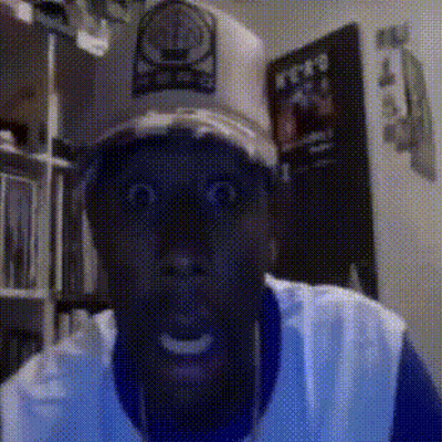 Man In Hat With Letter O Looks Surprised GIF
