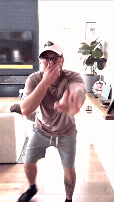 Man In Hat With Letter P Covering Mouth GIF