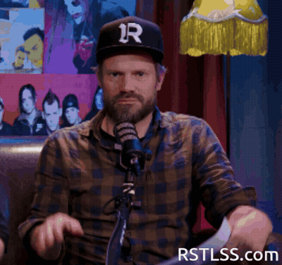 Man In Hat With Letter R At Microphone GIF