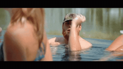 Man In Hat With Letter R In Hot Tub GIF