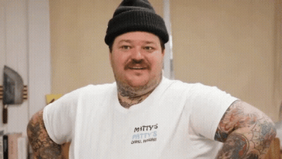 Man In Hat With Mitty's Patty's Shirt GIF