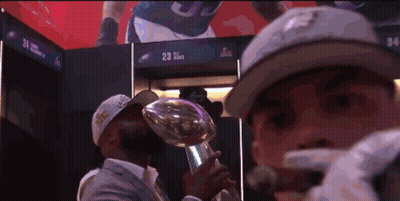 Man In Hat With Number 23 Holding Trophy GIF