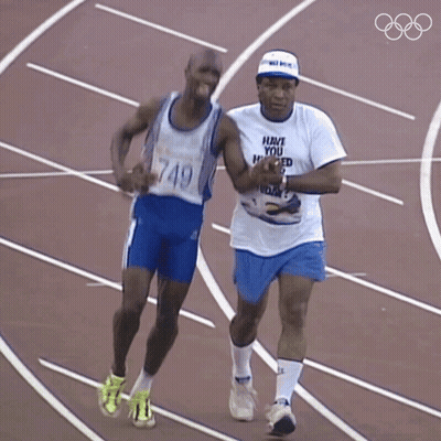 Man In Have You Heard T-Shirt Running With Another Man GIF