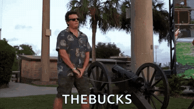 Man In Hawaiian Shirt Beside Cannon Saying The Bucks GIF
