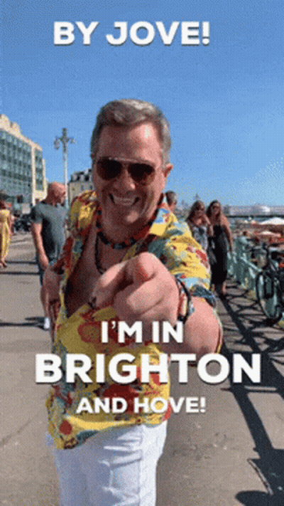 Man In Hawaiian Shirt Pointing At Camera Saying By Jove I'm In Brighton And Hove GIF