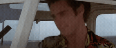 Man In Hawaiian Shirt Sitting In Boat GIF