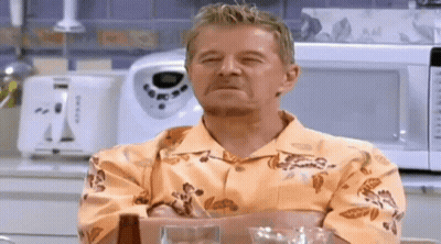 Man In Hawaiian Shirt Sitting With Eyes Closed GIF