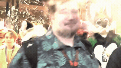 Man In Hawaiian Shirt With Name Tag Saying A GIF
