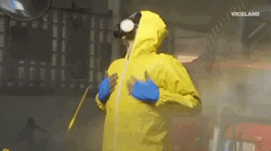 Man In Hazmat Suit Getting Disinfected GIF