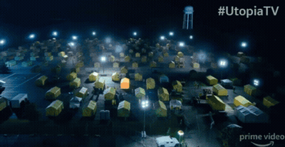 Man In Hazmat Suit Standing In Front Of Tents #UtopiaTV GIF