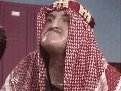 Man In Head Scarf And Keffiyeh Making A Face GIF