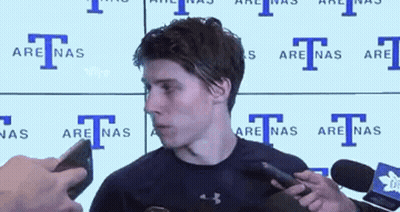 Man In Headband And Black Shirt Talking Into Microphone GIF