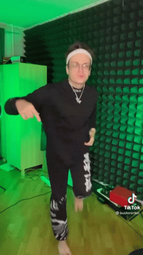 Man In Headband And Glasses Dancing In Green Lights GIF