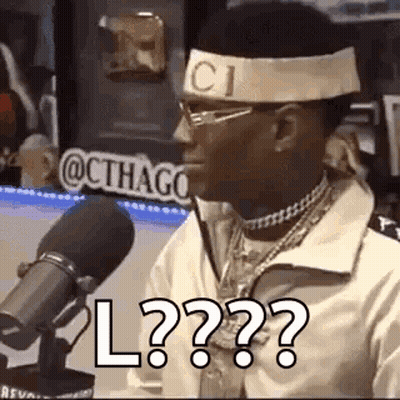 Man In Headband And Glasses Talking Into Microphone GIF