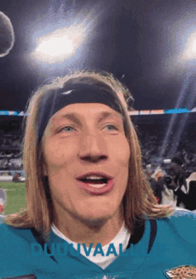 Man In Headband And Jaguars Jersey Looking At Camera GIF