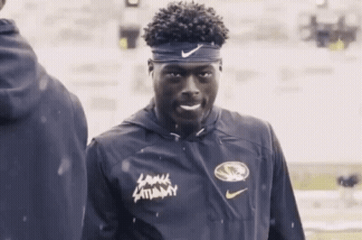 Man In Headband And Lamar Saturday Jacket GIF
