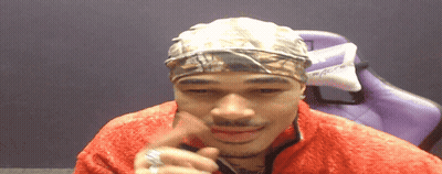 Man In Headband And Red Jacket With Purple Chair GIF