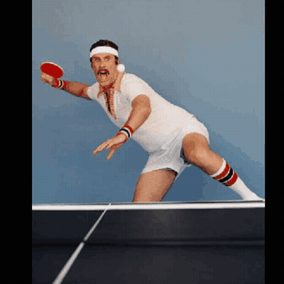 Man In Headband And Socks Playing Ping Pong GIF