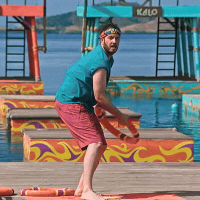 Man In Headband On Dock In Front Of Kalo Sign GIF