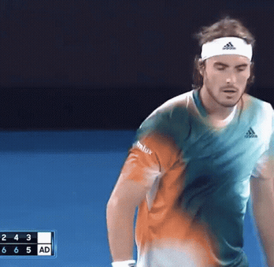 Man In Headband Playing Tennis On Blue Court GIF