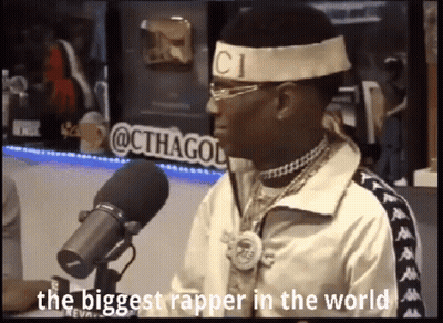 Man In Headband With CI Letter At Microphone GIF
