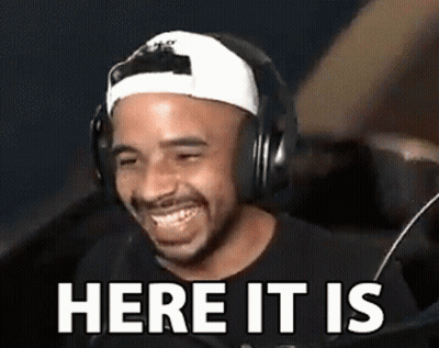 Man In Headphones And Baseball Cap Laughing Here It Is GIF