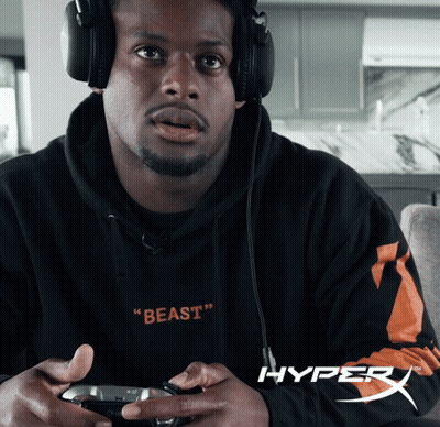 Man In Headphones And Beast Sweatshirt Holding Game Controller GIF