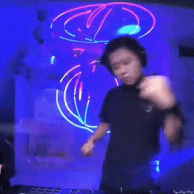 Man In Headphones And Black Shirt Playing DJ Set GIF