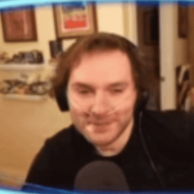 Man In Headphones And Black Shirt Smiling GIF