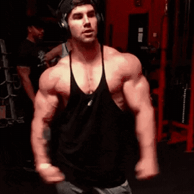 Man In Headphones And Black Tank Top In Gym GIF