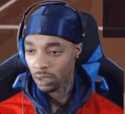 Man In Headphones And Blue Headband Gaming Chair GIF
