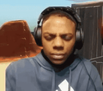 Man In Headphones And Blue Hoodie Looking Down GIF