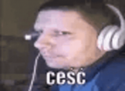 Man In Headphones And Blue Shirt At Computer GIF
