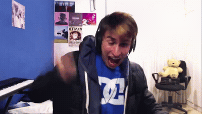 Man In Headphones And Blue Shirt Saying DC GIF